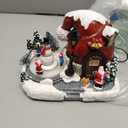 Christmas Village Lighted Musical Collectible Buildings - USB-Powered Santa's Hat House Scene with Snowman, Animated Holiday Figurines, LED Lights & Festive Music for Xmas Decor and Home Decorations