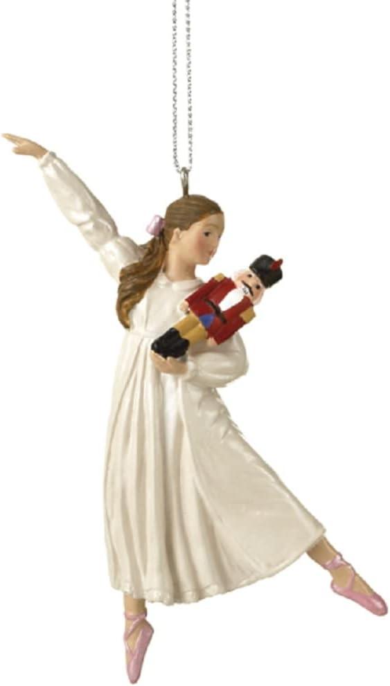 Clara Holding a Nutcracker Christmas Ornament