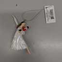 Clara Holding a Nutcracker Christmas Ornament