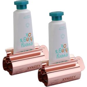 XYKEEY Toothpaste Tube Squeezer - Set of 2 Toothpaste Squeezer Rollers, Metal Toothpaste Tube Wringer Seat Holder Stand (Coral)
