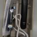 OralB iO Series 2 Rechargeable Electric Powered Toothbrush Starter Kit, Night Black with 2 Brush Heads  Automatic Pressure Sensor to Protect Gums  3 Modes  2 Min Timer