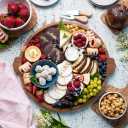 Charcuterie Board | Acacia Wood Serving Tray with Handles 13'' | Round Decorative Ottoman Coffee Table Tray | Circular Wooden Cheese Board Serving Platter for Party Supplies | Includes 1 Board