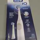 Oral-B Rechargeable Electric Toothbrush, iO2 Starter Kit, 3 Cleaning Modes, Automatic Pressure Sensor to Protect Gums, 2 Brush Heads, Pure White