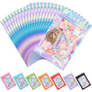 ANZNKU 100 Pack Mylar Bags Reasealable Holographic Bags, Smell Proof Bag Zipper Pouches with Clear Window, Jewelry Easter Candy Sealable Bag for Packaging Sample Party Favor (3.9 x 7.1 Inch)