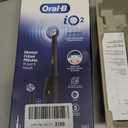 Oral-B Rechargeable Electric Toothbrush, iO2 Starter Kit, 3 Cleaning Modes, Automatic Pressure Sensor to Protect Gums, 2 Brush Heads, Night Black