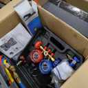 Orion Motor Tech AC Vacuum Pump and Gauge Set, 1/3 hp 4 cfm Vacuum Pump Manifold Gauge Kit with Leak Detector 3 Hoses & Accessories for R134a R12 R22 R502, A/C Vacuum Pump Kit for Auto HVAC Systems. Oil has leaked and the item is stained.