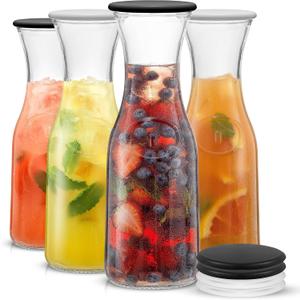 JoyJolt Glass Carafe with Lid, Set of 4 1 Liter Glass Pitcher for Mimosa Bar, Water, Iced Tea, Juice, Wine, Lemonade, Milk Dishwasher Safe Beverage Drink Dispensers for Brunch, Parties