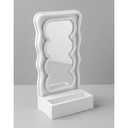 Orbit Wavy LED Light and Mirror Phone Holder is a multifunctional phone stand featuring a vibrant LED glow, a built-in mirror, and a trendy wave design for hands-free viewing Pack Of 2