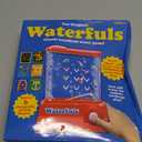 Playmonster Original Waterfuls Classic Handheld Water Games  Kids Games, Retro Travel Games, Fidget Toys for Kids, Autism Toys, 6 Interchangeable Back Panels, Screen Free Play, Portable, Ages 3+