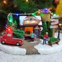 MOMENTS IN TIME Christmas Village Tree Lot Scene 6.7H Hand-Painted Polyresin with LED Lights Music Battery Operated Holiday Decor Collectible