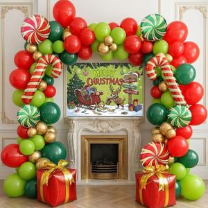 Christmas cartoon style party decorations include green red and gold balloon arch kit & candy canes lollipops gift boxes foil balloons & backdrop for Christmas New Year's Eve party decorations.