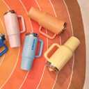 STANLEY Quencher ProTour Flip Straw Tumbler with Leakproof Lid 40 oz | Built-In Straw and Handle | Cup Holder Compatible for Travel | Insulated Stainless Steel Cup | BPA-Free | Peach Whip Gloss