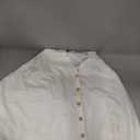 white scarf with buttons, no sleeves 