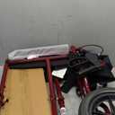 Medline Lightweight Foldable Transport Wheelchair with Handbrakes and 12-Inch Wheels, Red Frame, Black Upholstery