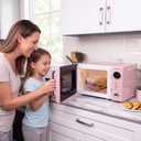 Nostalgia Countertop Microwave Oven with Easy Clean Interior - Retro Microwave with LED Display & Child Lock- Compact 0.7 Cu. Ft. Oven With 12 Pre-Programmed Settings for Quick Cooking- 700-Watts-Pink