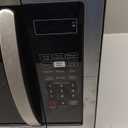 Farberware 1.1 Cu. Ft. Countertop Microwave Oven  1000 Watts Power, Auto Cook Settings, Defrost, Easy Clean and Child Safety Lock - Stainless