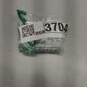 Clara Holding a Nutcracker Christmas Ornament