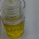 Olaplex No. 7 Bonding Oil, Concentrated High Shine Oil, Heat Protectant, Visibly Smooths & Softens Hair, Added Color Vibrancy, Up to 72 Hour Frizz Control, For All Hair Types, 1 fl oz