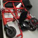 Medline Ultra Lightweight Transport Wheelchair for Adults, Foldable, 19-Inch Seat Width, Red Frame, Black Upholstery