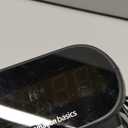 Amazon Basics Small Digital Oval Alarm Clock with LED Display, Nightlight, Snooze Function & Battery Backup, Black, 4.5 x 3.5 x 2.4 Inches