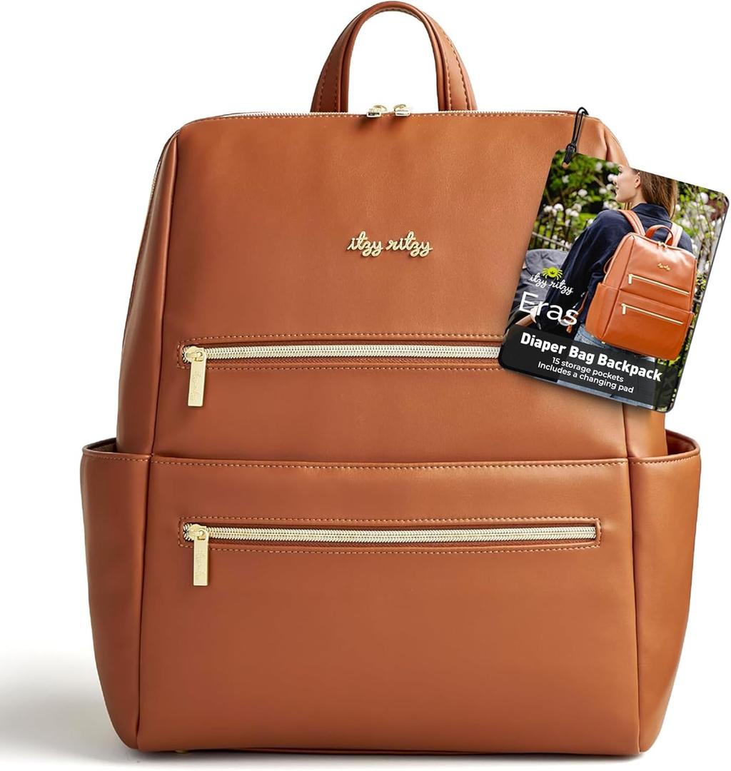 Itzy Ritzy Eras Diaper Bag Backpack  Large Capacity Backpack Diaper Bag Featuring Sleek Design, 15 Pockets, Changing Pad, Stroller Straps, and Luggage Sleeve (Cognac)