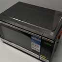 Farberware 0.9 Cu. Ft. Countertop Microwave Oven  900 Watts Power, Auto Cook Settings, Defrost, Easy Clean and Child Safety Lock - Stainless and Black