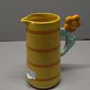 Tabletops Unlimited Cup of Happy Orange Daisy Pitcher