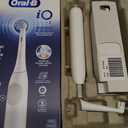 Oral-B Rechargeable Electric Toothbrush, iO2 Starter Kit, 3 Cleaning Modes, Automatic Pressure Sensor to Protect Gums, 2 Brush Heads, Pure White