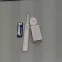 Oral-B Rechargeable Electric Toothbrush, iO2 Starter Kit, 3 Cleaning Modes, Automatic Pressure Sensor to Protect Gums, 2 Brush Heads, Pure White (1 Count (Pack of 1))