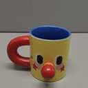 Clown Ceramic Mug, 10 oz Yellow Funny Face Coffee Cup with Blue Interior & Red Handle
