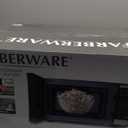Farberware 0.9 Cu. Ft. Countertop Microwave Oven 900 Watts Power, Auto Cook Settings, Defrost, Easy Clean and Child Safety Lock - Stainless and Black