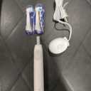 Oral-B iO Series 2 Rechargeable Electric Powered Toothbrush Starter Kit, Pure White with 2 Brush Heads - Automatic Pressure Sensor to Protect Gums - 3 Modes - 2 Min Timer