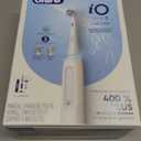 OralB iO Deep Clean Rechargeable Electric Powered Toothbrush, White with iO Series 3 Limited, 2 Brush Heads and Travel Case  Pressure Sensor to Protect Gums  3 Cleaning Settings  2 Minute Timer