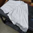 white scarf with buttons, no sleeves 