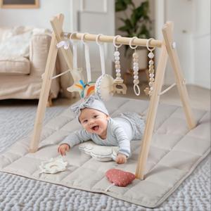 Wooden Play Gym with Beige Mat, Foldable Baby Play Gym, Infant Activity Mat with 6 Hanging Toys, Natural Pine Wood Frame Activity Center, Easy to Assemble & Clean, Newborn Present for Boys & Girls.