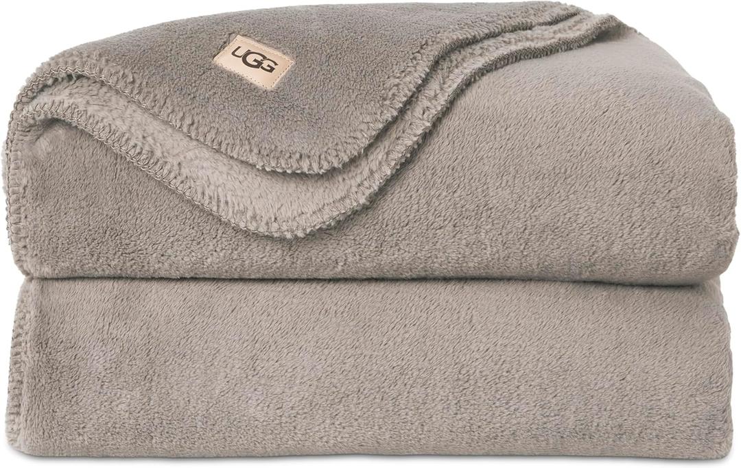 UGG Whitecap Plush Throw Blanket Fleece Lightweight Soft Cozy Throw for Couch Luxury Home Decor for Living Room Machine Washable Hypoallergenic Flannel Blankets, 50-inch x 70-inch, Light Grey Seal (Throw, Silver)