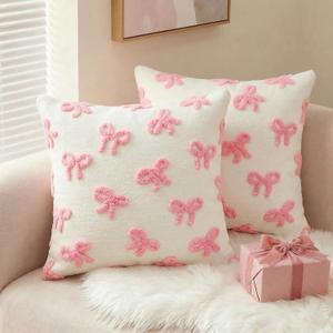 AVOIN colorlife Pink Bow Throw Pillow Covers Set of 2, 18 x 18 Inch Holiday Soft Plush Faux Fur Jacquard Cushion Case Decoration for Bedroom Home Sofa Couch