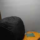 HIGOGOGO Round Stuffed Pouf Ottoman, Pu Leather Poufs with Foam Chunk Filling, Furry and Fluffy Pouf Foot Stool Storage Ottoman, 26 X 18 Floor Poufs Foot Rest for Living Room, Orange