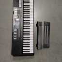 RockJam 61-Key Compact Keyboard with Sheet Music Stand, Power Supply, Piano Note Stickers and Simply Piano Lessons