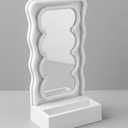 Orbit Wavy LED Light and Mirror Phone Holder is a multifunctional phone stand featuring a vibrant LED glow, a built-in mirror, and a trendy wave design for hands-free viewing