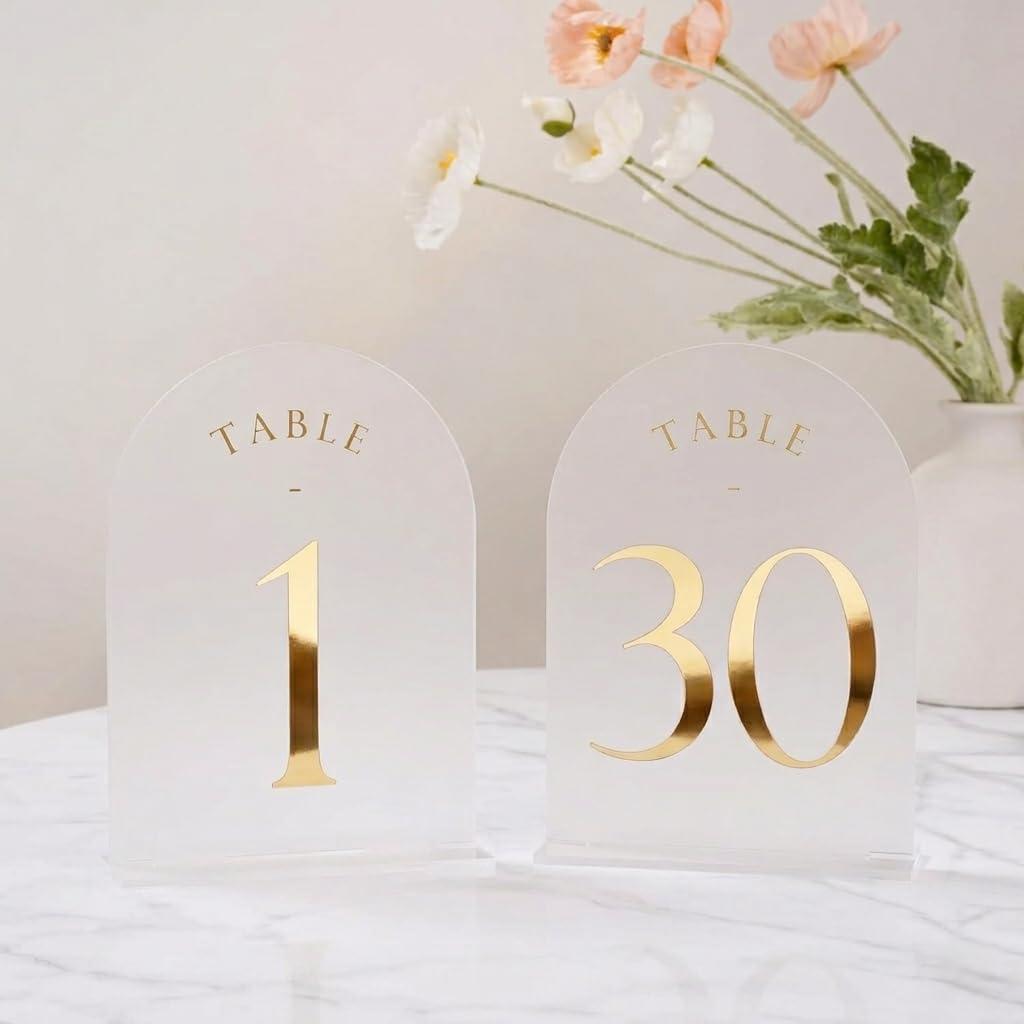 UNIQOOO Frosted Arch Wedding Table Numbers with Stands 1-30, Gold Foil Printed 5x7 Acrylic Display Signs and Holders, Pack of 30, Perfect for Centerpiece, Reception, Decoration, Party, Anniversary, Event