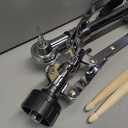 double-braced drum hardware stand with drumsticks and mounting clamp