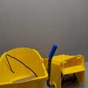 Carlisle FoodService Products 26-Quart Commercial Mop Bucket with Side-Press Wringer, Precision-Molded Polypropylene, Durable Wringer, Bucket with Non-Marking Casters, 18.5 x 16.5 x 23 Inches, Yellow