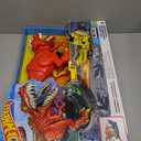 Hot Wheels Toy Car Track Set, T-Rex Rampage Playset & 1:64 Scale Vehicle, Launch into the Giant Dinosaur