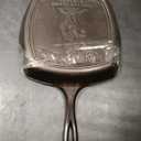 Lodge Pre-Seasoned Yellowstone Stamped Cast Iron Cookware - Signature Teardrop Handle & Assist Handle - Cowboy on Horseback 10.5 Inch Grill Pan