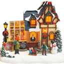 MOMENTS IN TIME Christmas Village Building Lighted Christmas Shop with LED Lights, Music & Snowman Battery Operated or Plug-in Vintage Holiday Village House Dcor 8.5H x 9.8W x 6.9D