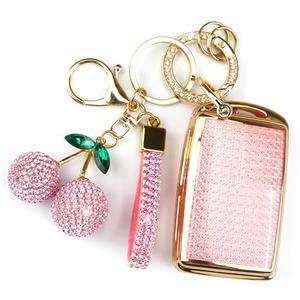 Rayslesan Sparkly Key Fob Cover with Cherry Keychain, Bling TPU Smart Key Case for Women, Compatible with Mazda 3 6,CX-30 CX-5 CX-50 CX-60 CX-70 CX-90, MX-5 Miata (Gold Pink)