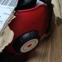 Radio Flyer Busy Buggy Ride On Toy Car with 17 Interactive Activities, Sit-to-Stand for Ages 1-3, Features Built-in Storage, Walk or Ride Options for Toddler Development and Play