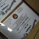 GraduationMall Double 8.5x11 Diploma Frame,Solid Wood & Tempered Glass,Black Finish with Gold Trim,Purple & Gold Mat