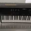 RockJam 61-Key Compact Keyboard with Sheet Music Stand, Power Supply, Piano Note Stickers and Simply Piano Lessons
